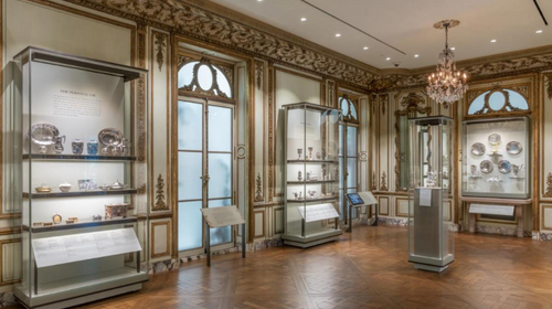 MFA French Salon period room with cases full of objects lining the walls.