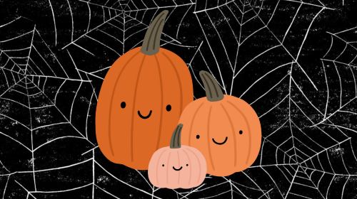 three pumpkins in front of a background of spiderwebs